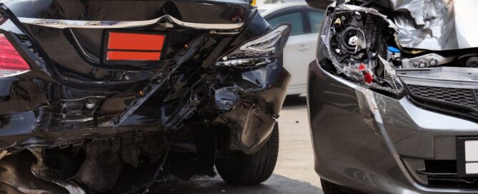 two vehicles with damaged rear lights