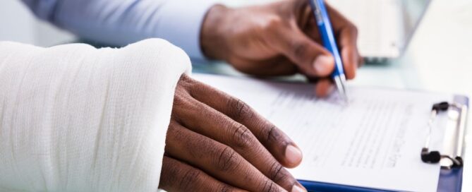 a man filling out a personal injury claim form